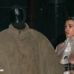 Fans express fears for Bianca Censori after latest explicit display where she stepped out nude under a clear raincoat with mask-clad husband Kanye West: 'She needs rescuing'