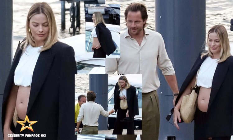 Margot Robbie, 34, exibe sua barriga em um top branco curto enquanto embarca cuidadosamente em um barco durante as férias no Lago Como com o marido Tom Ackerley