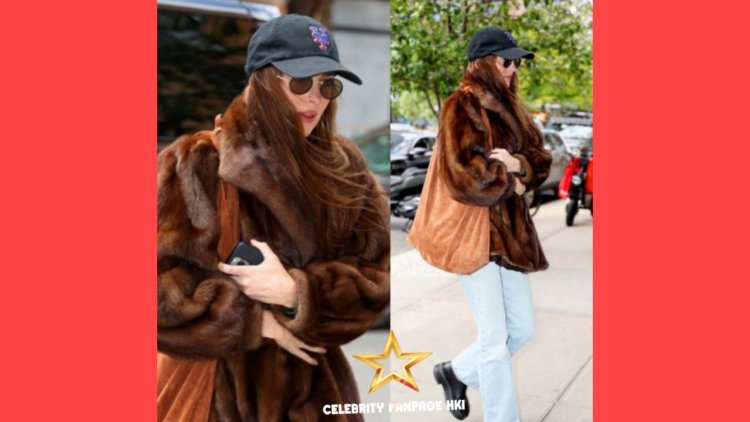 Dakota Johnson se apacolha em revestimento de pele por dia em Nova York