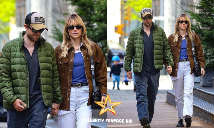 Robert Pattinson parece de bom humor enquanto segura a mão de sua parceira Suki Waterhouse durante um passeio romântico pela cidade de Nova York